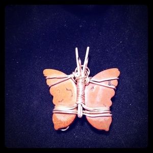 Hand wired silver on a pink/coral Butterfly stone